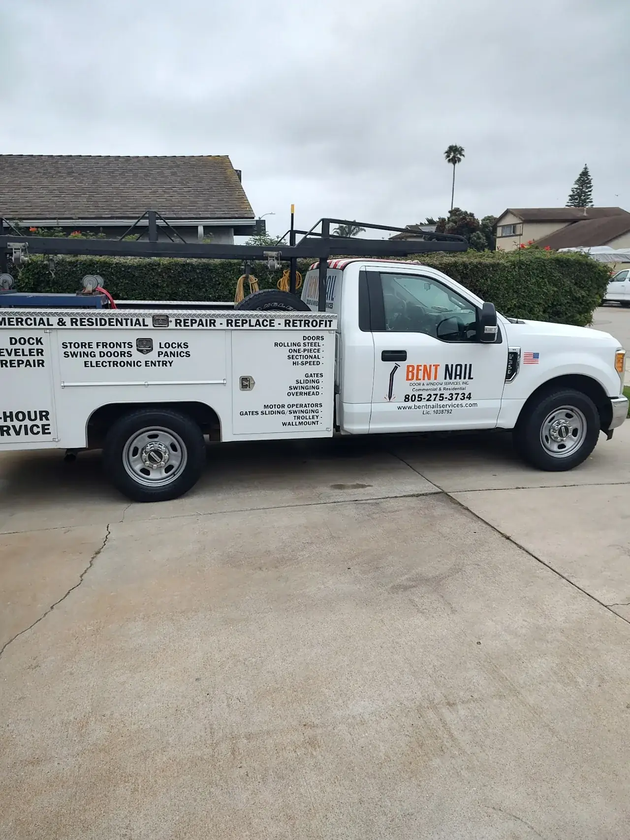 Bent Nail Door & Window Services service truck with commercial and residential door repair lettering in Oxnard, CA