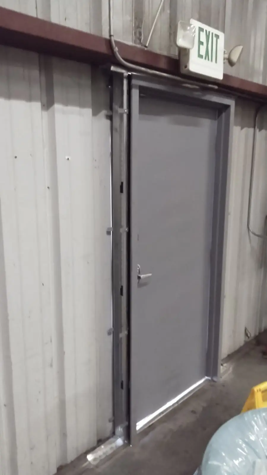 Newly installed commercial entry door with panic hardware at an Oxnard, CA business