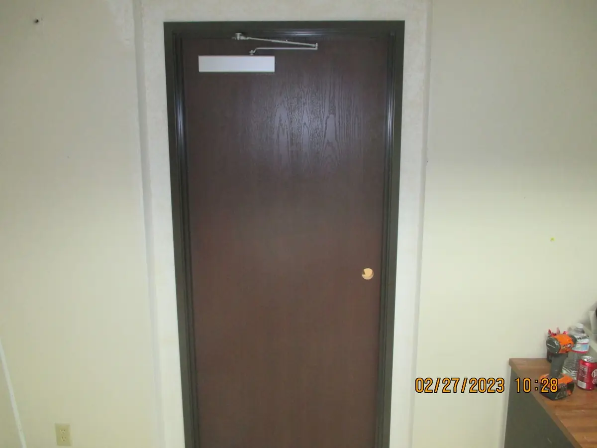 Door frame repair and new steel frame installation on a commercial opening
