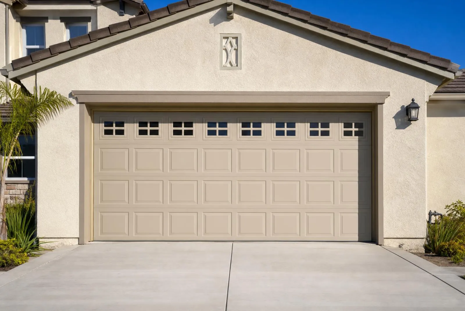 Residential two-car sectional garage door serviced by Bent Nail Door & Window Services in Oxnard, CA